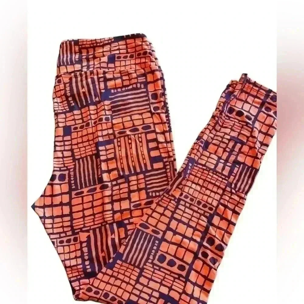 Lularoe TC (10-16) peach and navy blue abstract geometric leggings. NWOT .